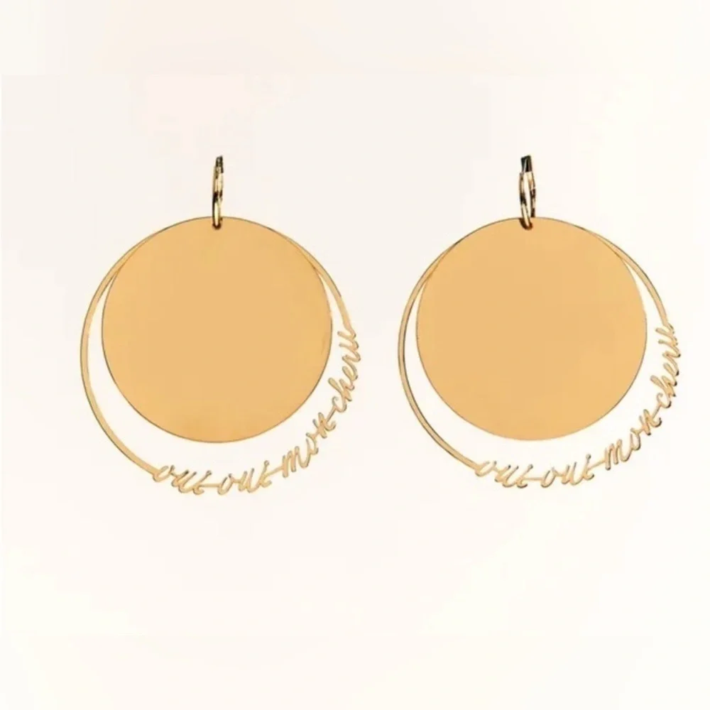 - NWT. Zara Golden Round Flat Metal Earrings with Text Detail.